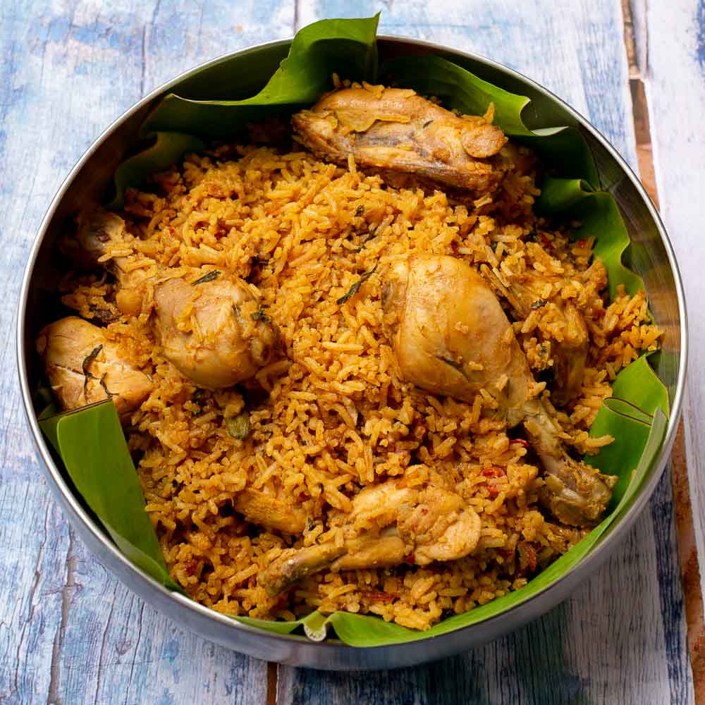 Chicken biryani with egg and raita